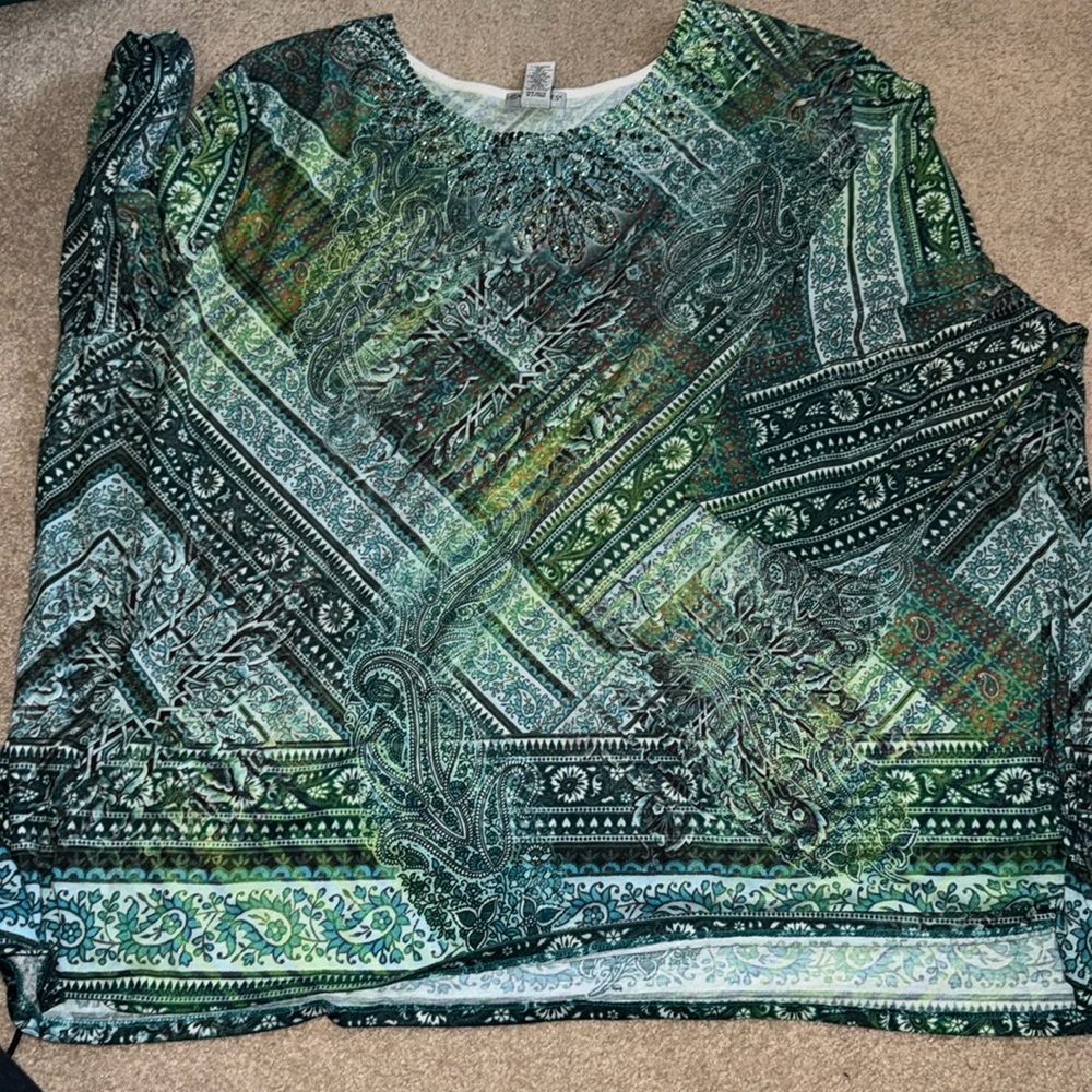 Colorful with greens with detail around neckline. Size 5x
